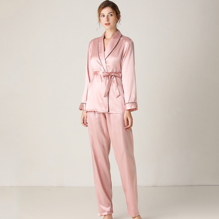 Pink satin pajama set with  wrap around top and elastic waist band and piping