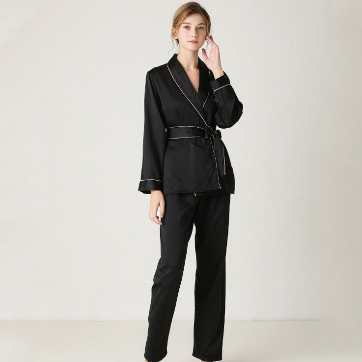 Black satin pajama set with wrap around top and elastic waist band and piping